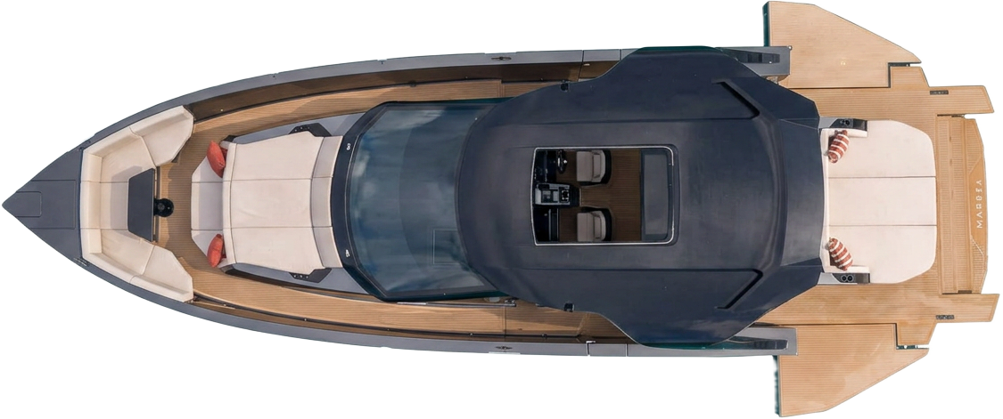 Manari 52 seen from above, lying at anchor on clear turquoise water