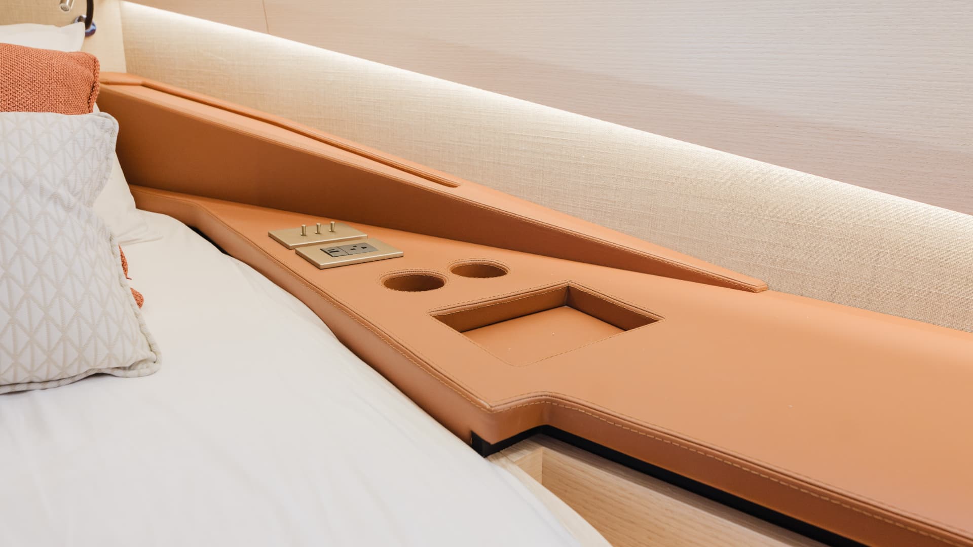 Saddle leather bedside detail in the Manari 52 master cabin
